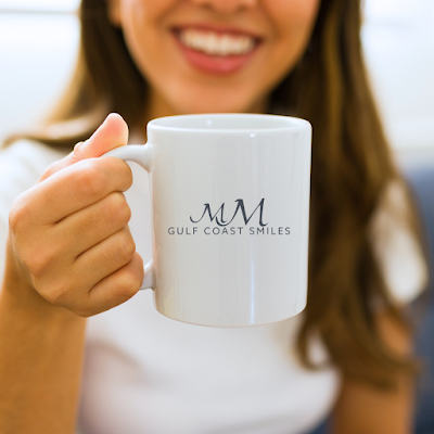 woman holding branded mug
