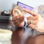 dr-martinez-holding-full-arch-dental-implants-model-scaled